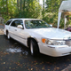 Illustration for article titled At $7,500, Would You Go To Town In This Custom 2000 Lincoln Town Car Station Wagon?